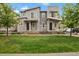 Stylish two-story home boasts modern design, manicured lawn, and welcoming entrance at 23615 E 5Th Pl, Aurora, CO 80018