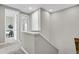 Second floor hallway with neutral walls, carpeted flooring, and access to multiple rooms at 23615 E 5Th Pl, Aurora, CO 80018