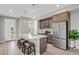 Modern kitchen featuring stainless steel appliances, a center island, and stylish pendant lighting at 23615 E 5Th Pl, Aurora, CO 80018