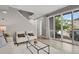 Bright living room showcasing stylish décor and a seamless connection to the outdoor space at 23615 E 5Th Pl, Aurora, CO 80018
