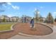 Community playground area with modern play structure and seating, set in landscaped area at 23615 E 5Th Pl, Aurora, CO 80018