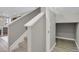 Carpeted stairs with white railing and a storage closet underneath, leading to the upper level at 23615 E 5Th Pl, Aurora, CO 80018