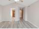 Vaulted ceiling bedroom with modern grey flooring and multiple doorway access at 5857 S Zante Cir, Aurora, CO 80015