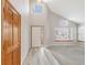 Spacious foyer with soaring ceilings and large windows providing ample natural light at 5857 S Zante Cir, Aurora, CO 80015