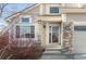 Close-up of the home's entrance, highlighting the brickwork and well-lit entryway at 5857 S Zante Cir, Aurora, CO 80015