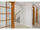 Hallway with modern flooring and decorative french doors at 5857 S Zante Cir, Aurora, CO 80015