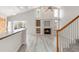 Inviting living room with a cozy fireplace and built-in shelving, perfect for entertaining at 5857 S Zante Cir, Aurora, CO 80015