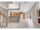 Bright, open layout connecting the kitchen and living areas, with modern appliances and fixtures at 5857 S Zante Cir, Aurora, CO 80015