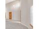 Open-concept living space featuring vaulted ceilings, a pendant light, and neutral wall colors at 5857 S Zante Cir, Aurora, CO 80015