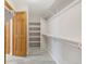 Walk-in closet featuring rod and shelving at 5857 S Zante Cir, Aurora, CO 80015