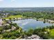 Scenic aerial shot featuring a serene lake and green spaces in the surrounding area at 11719 W 45Th Pl, Wheat Ridge, CO 80033