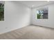 Bright and airy bedroom with neutral carpeting and large windows offering ample natural light at 11719 W 45Th Pl, Wheat Ridge, CO 80033