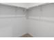 Clean closet featuring rods and shelves, offering practical storage at 11719 W 45Th Pl, Wheat Ridge, CO 80033