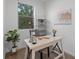 Bright home office with a large window, desk space, and modern decor at 11719 W 45Th Pl, Wheat Ridge, CO 80033
