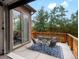 Charming patio with outdoor seating, ideal for enjoying the serene backyard view at 11719 W 45Th Pl, Wheat Ridge, CO 80033