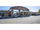 Front exterior of a two-story bike shop with glass storefront, stone accents, and signage at 10157 W 38Th Ave, Wheat Ridge, CO 80033