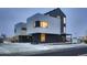 Modern home with black brick accents, large windows, and a for sale sign at 10157 W 38Th Ave, Wheat Ridge, CO 80033