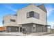 Modern townhouse showcasing unique architectural details with brick and concrete at 10157 W 38Th Ave, Wheat Ridge, CO 80033
