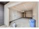 An unfinished garage has two doors, concrete floor, and open ceiling at 10157 W 38Th Ave, Wheat Ridge, CO 80033
