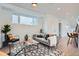 Cozy living room features a comfortable couch, accent chairs and a geometric-patterned rug at 10157 W 38Th Ave, Wheat Ridge, CO 80033