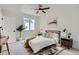 Serene bedroom with a comfortable bed, big windows, and modern minimalist decor at 10157 W 38Th Ave, Wheat Ridge, CO 80033