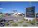 Outdoor marketplace showing sign, landscaping, a tower and an industrial building at 10157 W 38Th Ave, Wheat Ridge, CO 80033