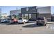 Starbucks and businesses with parking lot and cars at 10157 W 38Th Ave, Wheat Ridge, CO 80033