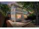 Charming home's backyard featuring a patio, well-maintained lawn, and mature trees at 1260 S Emerson St, Denver, CO 80210