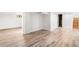 Finished basement showcasing wood-look flooring and closet or storage room with potential at 1260 S Emerson St, Denver, CO 80210