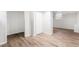 Partially finished basement featuring neutral walls and durable wood-look flooring for various uses at 1260 S Emerson St, Denver, CO 80210