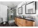 Bathroom features double sinks, frameless shower with multiple shower heads, and stylish fixtures at 1260 S Emerson St, Denver, CO 80210