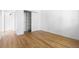 Bright bedroom with hardwood floors and closet with sliding doors, offering ample storage space at 1260 S Emerson St, Denver, CO 80210