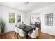 Bright dining room featuring hardwood floors, a modern table with seating, and ample natural light and open access to living spaces at 1260 S Emerson St, Denver, CO 80210