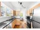 Bright and functional kitchen featuring granite countertops, stainless steel appliances, and ample cabinet space, perfect for cooking at 1260 S Emerson St, Denver, CO 80210