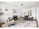 Inviting living room featuring a fireplace, hardwood floors, stylish furniture, and ample natural light for a cozy atmosphere at 1260 S Emerson St, Denver, CO 80210