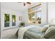 Bright bedroom with large windows, carpet flooring, and patio access at 1260 S Emerson St, Denver, CO 80210