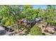 Street view of charming brick homes shaded by mature trees, blending curb appeal and nature's beauty at 1260 S Emerson St, Denver, CO 80210