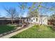 Lush backyard with a wooden pergola-covered patio, perfect for outdoor entertaining and relaxation at 1711 Spruce St, Denver, CO 80220