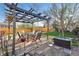 Backyard patio with pergola and outdoor dining set, ideal for entertaining at 1711 Spruce St, Denver, CO 80220
