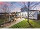 Charming backyard featuring a wooden pergola over a patio, perfect for outdoor dining and entertaining at sunset at 1711 Spruce St, Denver, CO 80220
