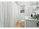 Bright bathroom with a shower, modern vanity, and stylish fixtures at 1711 Spruce St, Denver, CO 80220