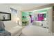 Bright bedroom features a cozy seating area, study space, and colorful accents at 1711 Spruce St, Denver, CO 80220