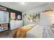 Bright bedroom with large window, dark accent wall, and modern dresser at 1711 Spruce St, Denver, CO 80220