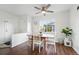 Cozy dining area with natural light, ceiling fan, wood table, and views of the outdoors at 1711 Spruce St, Denver, CO 80220