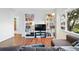 Cozy living room features hardwood floors, a comfortable sectional sofa, and built-in shelving at 1711 Spruce St, Denver, CO 80220