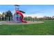 Community playground featuring modern equipment and a safe, grassy play area at 1711 Spruce St, Denver, CO 80220