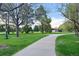 Enjoy the serene walking path surrounded by lush greenery and mature trees at 1711 Spruce St, Denver, CO 80220