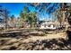 Large backyard with mature trees, offers privacy and space for outdoor activities and relaxation at 36635 View Ridge Dr, Elizabeth, CO 80107