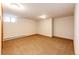 Spacious basement area with neutral carpet and a window at 36635 View Ridge Dr, Elizabeth, CO 80107