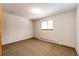 Bright bedroom with neutral carpet, a window, and baseboard heating at 36635 View Ridge Dr, Elizabeth, CO 80107